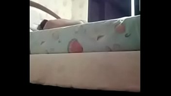 Teen girl gently massages her natural tits and caresses her hairy pussy with her hand