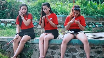 Teen girl gives her friends a peek under her skirt on a fishing trip