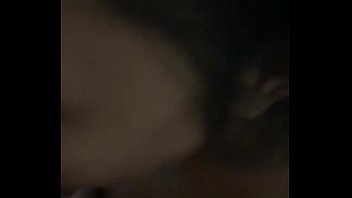 Indonesian woman sucking cock and licking her lover's balls in the dark