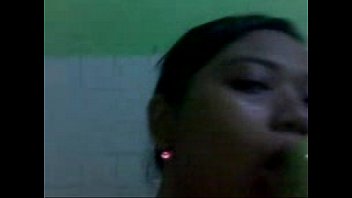 Nurse satisfies herself with a cucumber during her lunch break at the hospital